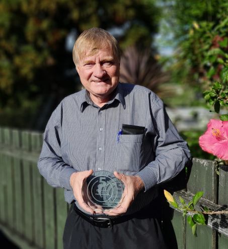 person holding an award