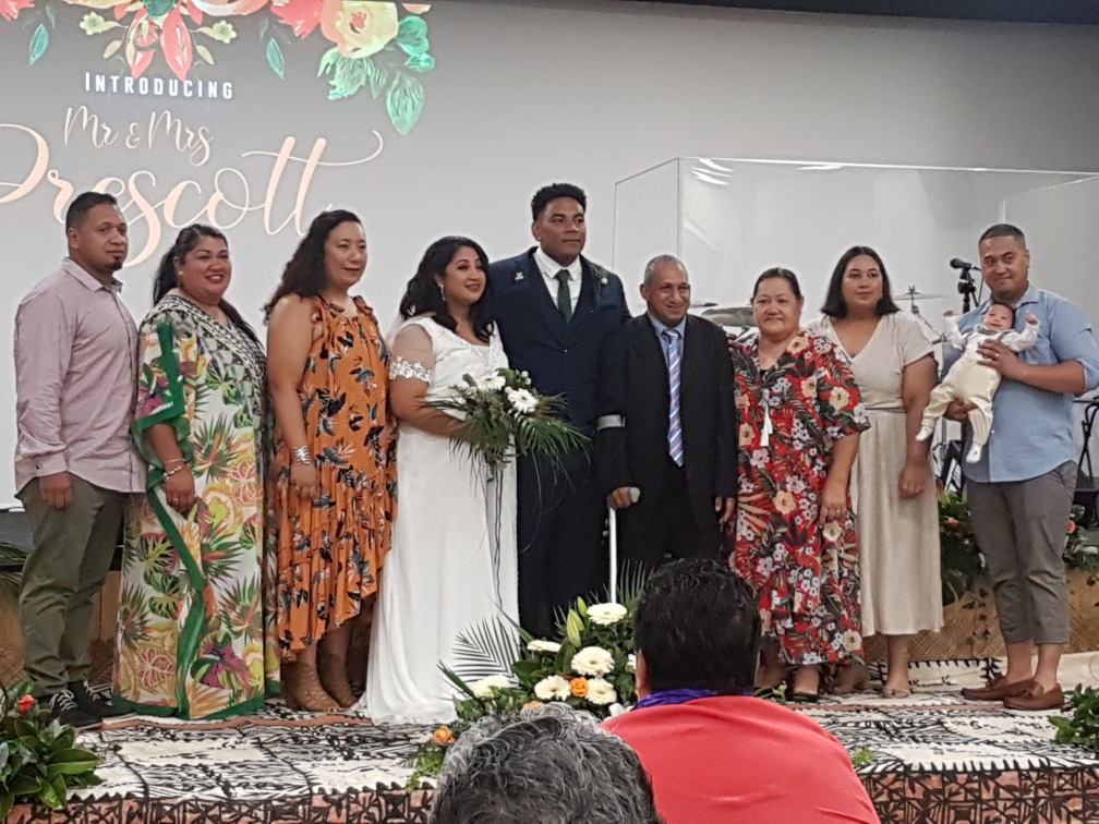 a wedding party with bride and groom